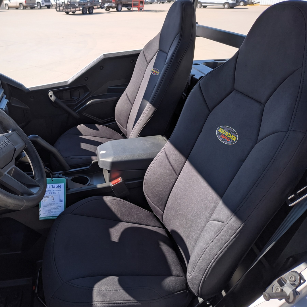 MudderSwag padded neoprene seat covers installed on Polaris General driver and passenger bucket seats showing custom-tailored fit