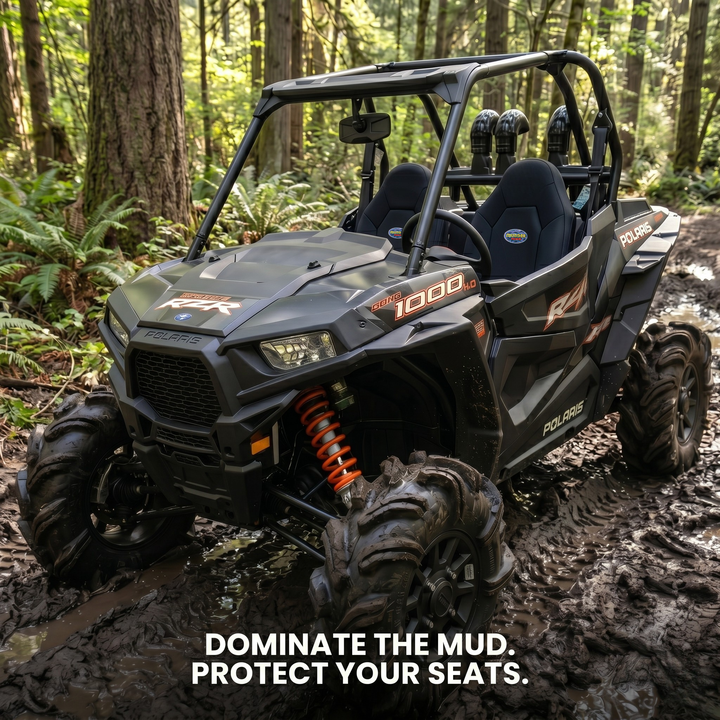 Polaris RZR with MudderSwag bucket seat covers in mud and trail conditions